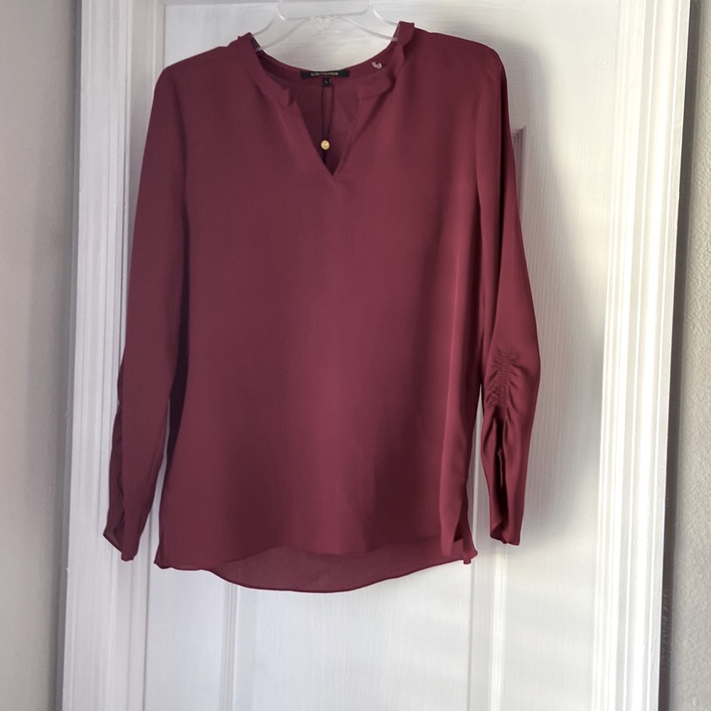 New blouse .light wear . Elegant can be worn with an undershirt .